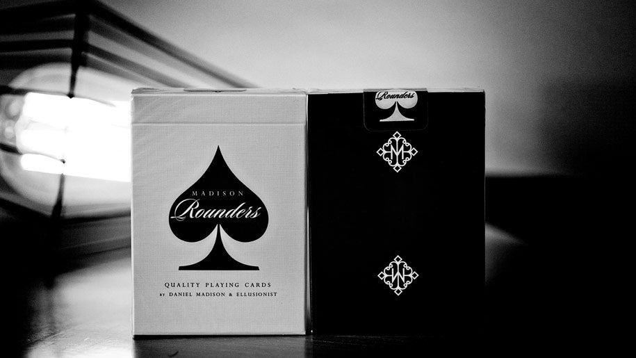 Two playing card boxes, one black and one silver, with 'Madison Rounders' branding.
