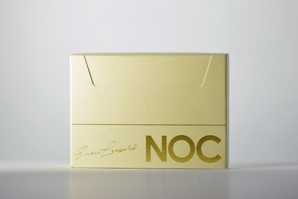 NOC Snow Leopard Signature gold foiling on tuck box