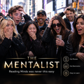 A group of surprised and excited people standing in a city street, with large promotional text reading 'THE MENTALIST' and the tagline 'Reading Minds was never this easy.' A vertical blurred censor block covers the center of the group.