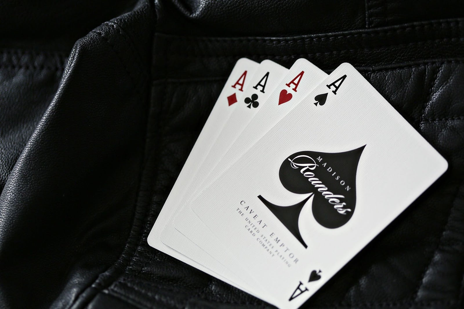 Madison Rounders White Playing Cards — four aces with Madison Remains branding, premium cardistry deck